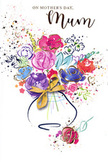 Lively Mother's Day card design showing a radiant, watercolour bouquet overflowing from a softly rounded vase, painted with the same care a Norbury florist brings to a hand-tied arrangement. Lush purples, playful pinks, glowing reds and serene blues mingle together in loose, expressive blooms, with deep indigo strokes suggesting petal edges and layered petals that spiral outward. The colours bleed and blend gently into one another, creating a sense of movement, as if the bouquet were gently turning in a light breeze drifting down London Road. Fine flickers of gold highlight certain petals and leaves, adding a delicate shimmer that recalls the glint of early morning light on freshly cut stems. Around the main cluster, flecks and splashes of paint dance across the clean white card, like petals tossed in celebration or confetti scattered after a family gathering. Small hearts are tucked among the splatters, reinforcing the message of love and appreciation. The vase is simple but elegant, its curved silhouette painted in pale, translucent tones, finished with a tidy golden bow that evokes the crinkle of ribbon being tied in a local shop before a delivery heads out across Norbury. The overall impression is airy yet heartfelt, capturing the joy of saying thank you, Mum with colour and flowers. This illustrated bouquet feels like a visual embrace, a keepsake that pairs beautifully with real blooms arriving at her door on Mother's Day.